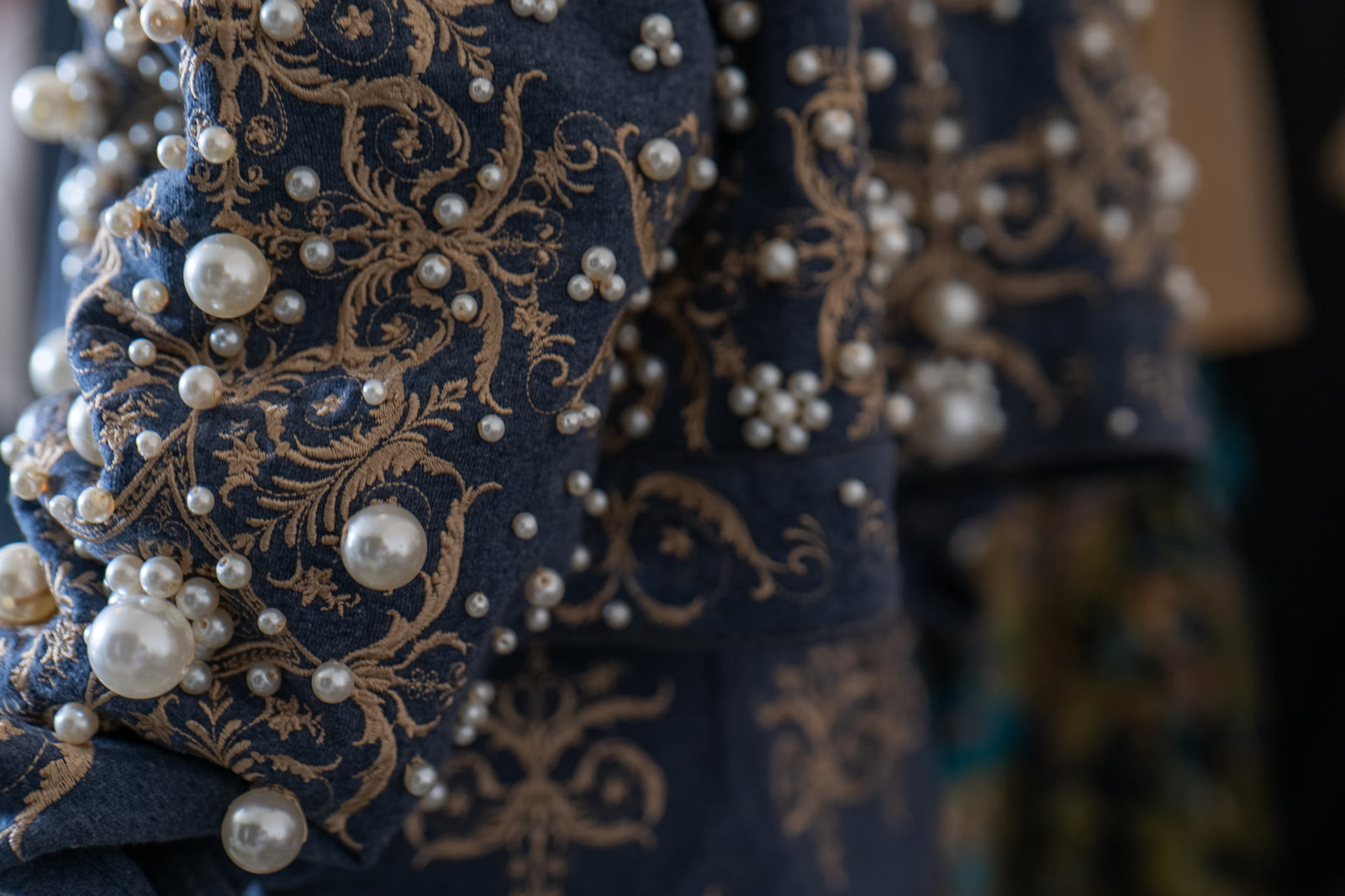 Pearl embroidery and gold-thread detail — Toribio & Donato ocean collection