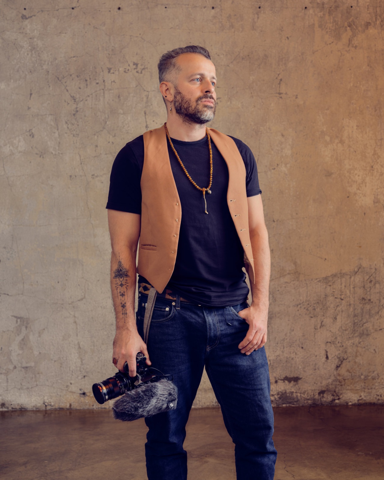 Krzysztof Piatkowski in studio, camera in hand